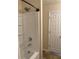 Bathroom featuring a shower-tub combo with a white shower surround at 304 Morning Star Drive Dr, Temple, GA 30179