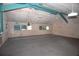 Expansive bonus room with high ceilings, multiple windows, and neutral carpet, offering a versatile space at 4011 Florida Ave, Atlanta, GA 30360