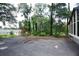 Spacious driveway area surrounded by lush greenery and landscaping at 4011 Florida Ave, Atlanta, GA 30360
