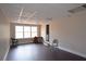Open living room features great natural light, wood floors, and a neutral color palette at 4011 Florida Ave, Atlanta, GA 30360