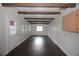 Spacious living room with wooden beams, hardwood floors, and ample lighting at 4011 Florida Ave, Atlanta, GA 30360