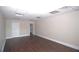 Hardwood floors and bright lighting in an empty living space at 4011 Florida Ave, Atlanta, GA 30360