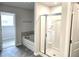 Bright bathroom features a tub, walk-in shower, and neutral gray color scheme at 684 Sundial Ln, Mableton, GA 30126