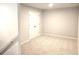Neutral bedroom featuring carpeted floors and a white door at 684 Sundial Ln, Mableton, GA 30126