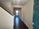 Bright entryway with hardwood floors, neutral walls, and a view into the open-concept living area at 684 Sundial Ln, Mableton, GA 30126