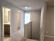 Upstairs hallway with neutral walls and carpeting, and open doors to the bathroom and rooms at 684 Sundial Ln, Mableton, GA 30126