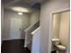 Bright hallway leading to stairs, white trim and doors and a half bathroom on the first floor at 684 Sundial Ln, Mableton, GA 30126