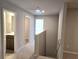 Upstairs hallway with carpet, a linen closet, and doorways into several rooms at 684 Sundial Ln, Mableton, GA 30126