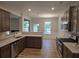 Modern kitchen with stainless steel appliances, granite countertops, and open to the dining area at 684 Sundial Ln, Mableton, GA 30126