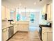 Modern kitchen features granite countertops, stainless steel appliances, and ample cabinet space at 684 Sundial Ln, Mableton, GA 30126
