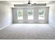 Spacious main bedroom with ceiling fan and three large windows at 684 Sundial Ln, Mableton, GA 30126