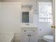 Bathroom features a vanity, tiled walls, and a window at 1810 Oakmont Nw Dr, Atlanta, GA 30314