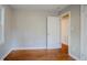 Bedroom featuring hardwood floors with an open door that leads to another room at 1810 Oakmont Nw Dr, Atlanta, GA 30314