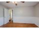 Bedroom features wainscoting, ceiling fan and door to a bathroom at 1810 Oakmont Nw Dr, Atlanta, GA 30314