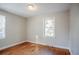 Charming bedroom with hardwood floors and natural light from two windows at 1810 Oakmont Nw Dr, Atlanta, GA 30314