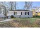 Charming, single-story home with grey brick and well-kept front yard at 1810 Oakmont Nw Dr, Atlanta, GA 30314