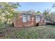 Cozy brick home featuring multi-pane windows and a well-maintained roof at 1810 Oakmont Nw Dr, Atlanta, GA 30314