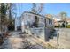 Exterior view of the back of this single story home showing the steps and retaining wall at 1810 Oakmont Nw Dr, Atlanta, GA 30314