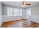 Bright living room with hardwood floors, white trim, and large windows at 1810 Oakmont Nw Dr, Atlanta, GA 30314