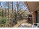 Balcony with railing featuring a view of trees and the brick exterior at 4526 Golf Vista Cir, Decatur, GA 30035