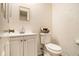 Bathroom with a white vanity, toilet and basket on the back of the toilet at 4526 Golf Vista Cir, Decatur, GA 30035