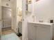 Bathroom with a gray vanity, light colored walls and view to the staircase at 4526 Golf Vista Cir, Decatur, GA 30035