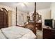Bedroom featuring a four poster bed, chest of drawers and exterior access at 4526 Golf Vista Cir, Decatur, GA 30035