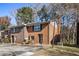 Brick townhome features a traditional design with a front parking lot and lamppost at 4526 Golf Vista Cir, Decatur, GA 30035