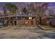 Brick townhome during sunset features a traditional design with a front parking lot at 4526 Golf Vista Cir, Decatur, GA 30035