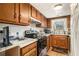Efficient kitchen with wood cabinets, ample counter space, and modern appliances at 4526 Golf Vista Cir, Decatur, GA 30035