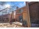 A brick patio leads to the sliding doors of this multi-level home with an upper-level balcony and brick facade at 4526 Golf Vista Cir, Decatur, GA 30035
