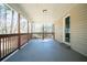 View of the back porch with wood railings and ceiling, a perfect place to relax at 5498 Balmoral Dr, Douglasville, GA 30135