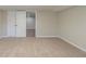 The finished basement is carpeted and features a closet for storage at 5498 Balmoral Dr, Douglasville, GA 30135