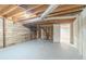 Spacious unfinished basement with exposed wood ceiling at 5498 Balmoral Dr, Douglasville, GA 30135