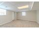 The carpeted basement features a drop ceiling and two windows at 5498 Balmoral Dr, Douglasville, GA 30135