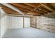 Unfinished basement featuring exposed ductwork, and partial wood paneled wall at 5498 Balmoral Dr, Douglasville, GA 30135