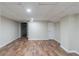 Finished basement area with wood look flooring at 5498 Balmoral Dr, Douglasville, GA 30135