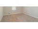A carpeted bedroom with a window for plenty of natural light at 5498 Balmoral Dr, Douglasville, GA 30135