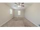 An expansive, carpeted bedroom bathed in soft, natural light and ready for your personal touch at 5498 Balmoral Dr, Douglasville, GA 30135