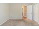 Cozy bedroom with plush carpet and a closet, conveniently located near the hall at 5498 Balmoral Dr, Douglasville, GA 30135