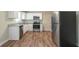Stylish kitchen with stainless steel appliances, granite countertops, and ample cabinet space at 5498 Balmoral Dr, Douglasville, GA 30135