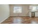Modern kitchenette featuring stainless steel appliances, white cabinets, and a window for natural light at 5498 Balmoral Dr, Douglasville, GA 30135
