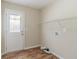 An efficient laundry room with tile flooring and hook-ups for dryer at 5498 Balmoral Dr, Douglasville, GA 30135