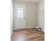A clean laundry room with wood-look floors and a utility sink hook-up at 5498 Balmoral Dr, Douglasville, GA 30135