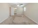 Spacious carpeted main bedroom with ceiling fan, and an open doorway to an en-suite bathroom at 5498 Balmoral Dr, Douglasville, GA 30135