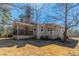 Single story home with a large, covered porch and a nice backyard, perfect for relaxation and outdoor activities at 5498 Balmoral Dr, Douglasville, GA 30135