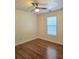 Cozy bedroom with wood floors and a ceiling fan at 682 New England Way, Lawrenceville, GA 30046