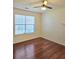 Bedroom with wood floors and a bright window at 682 New England Way, Lawrenceville, GA 30046