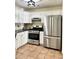 Modern kitchen with stainless steel appliances and ample counter space at 682 New England Way, Lawrenceville, GA 30046