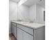 Bathroom with gray cabinets and a double sink vanity with granite countertops at 745 Great Oak Pl, Villa Rica, GA 30180